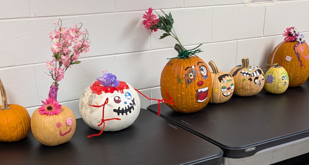 TILT students decorating pumpkins together