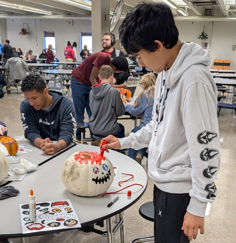 TILT students decorating pumpkins together