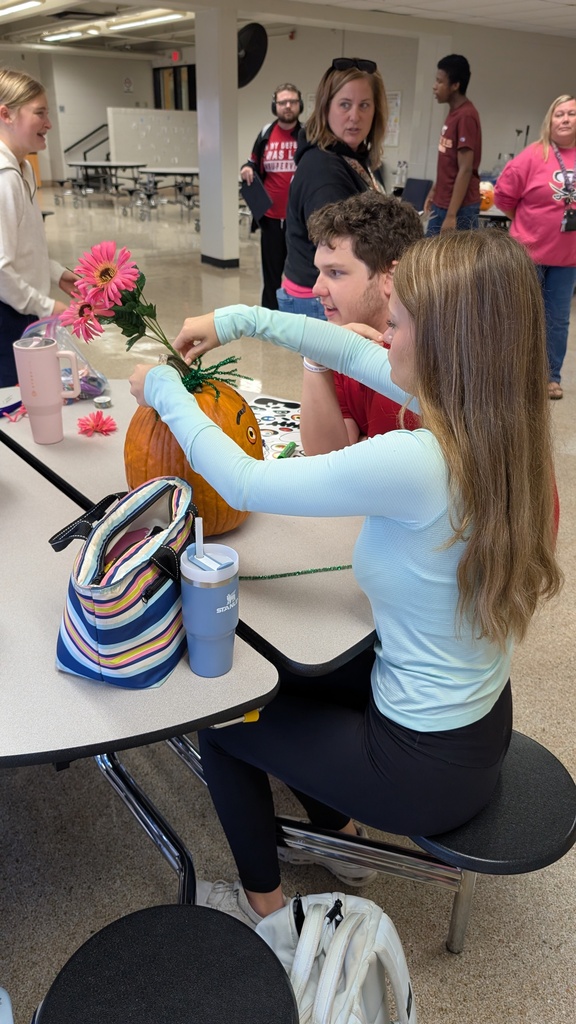TILT students decorating pumpkins together