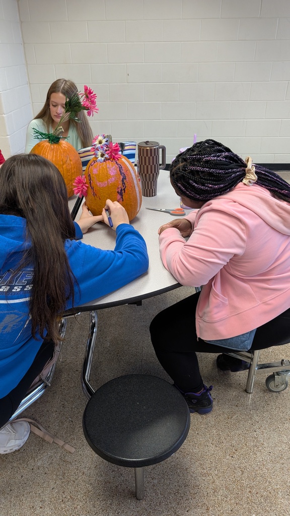 TILT students decorating pumpkins together