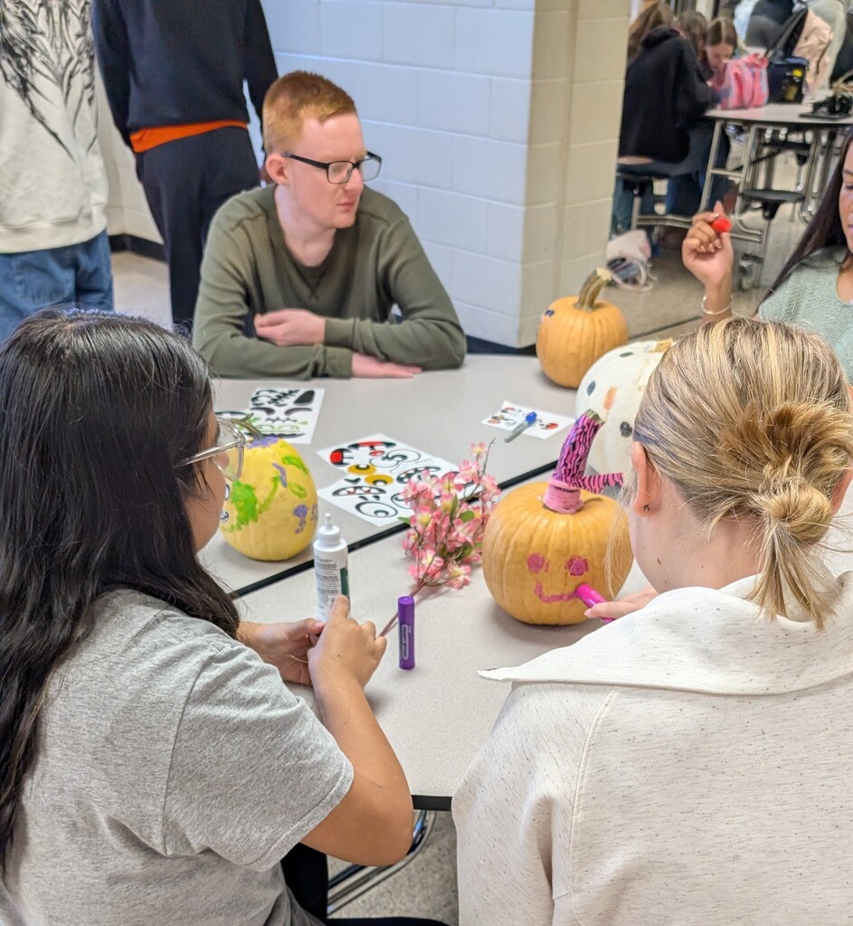 TILT students decorating pumpkins together