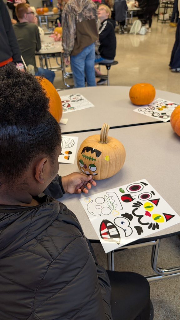 TILT students decorating pumpkins together