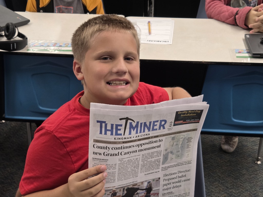 Student holding newspaper