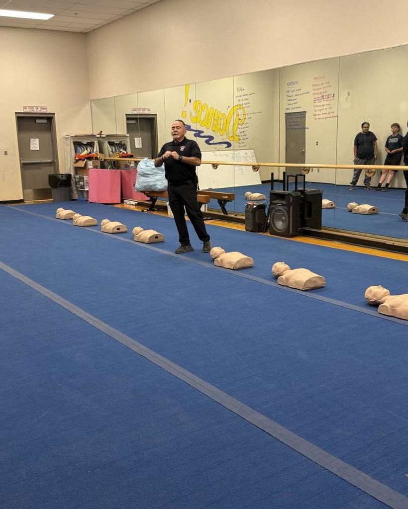 Oscar Lopez teaching seniors CPR