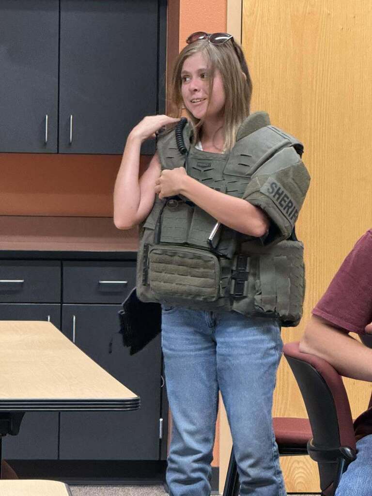 Student trying on SWAT gear