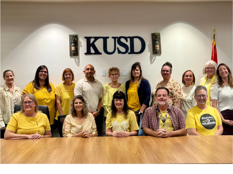 Staff wearing gold