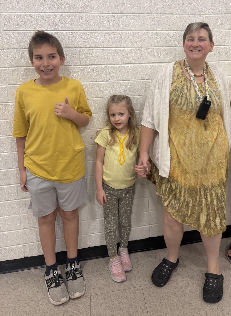 Staff wearing gold