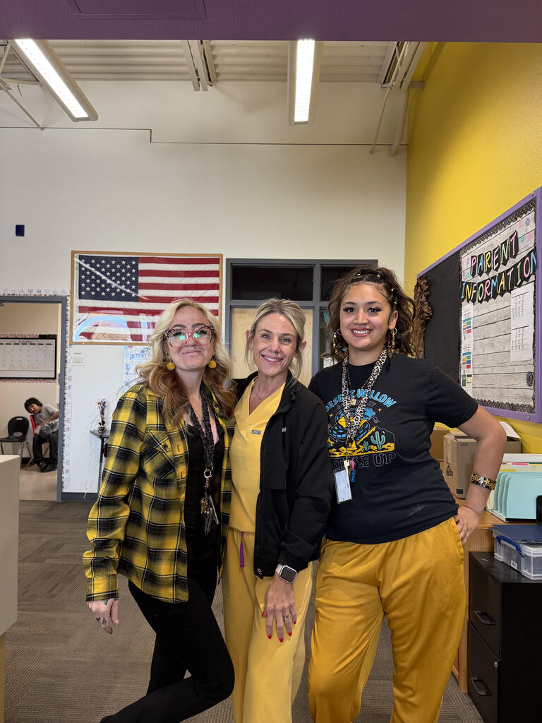 Staff wearing gold