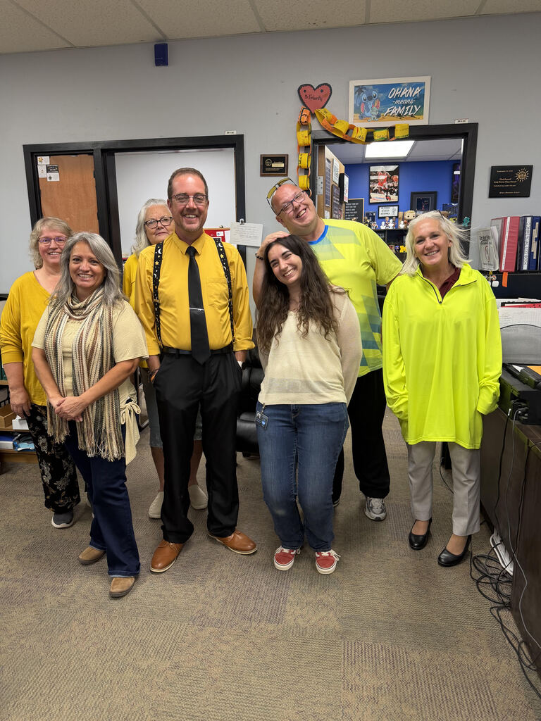Staff wearing gold