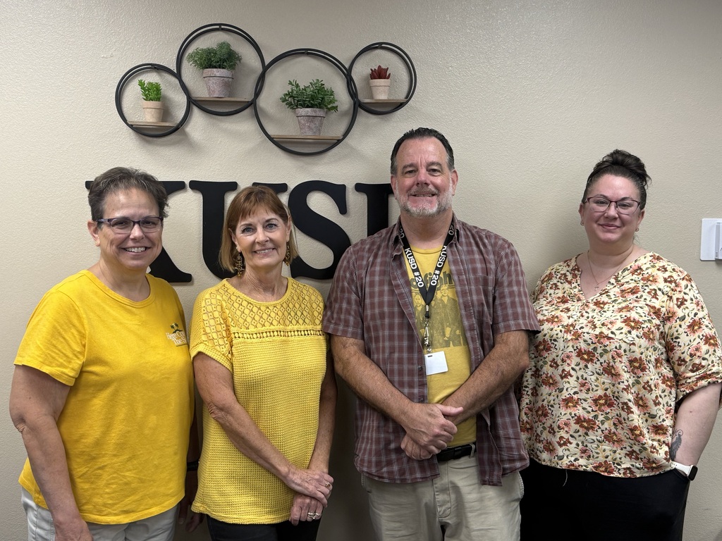Staff wearing gold