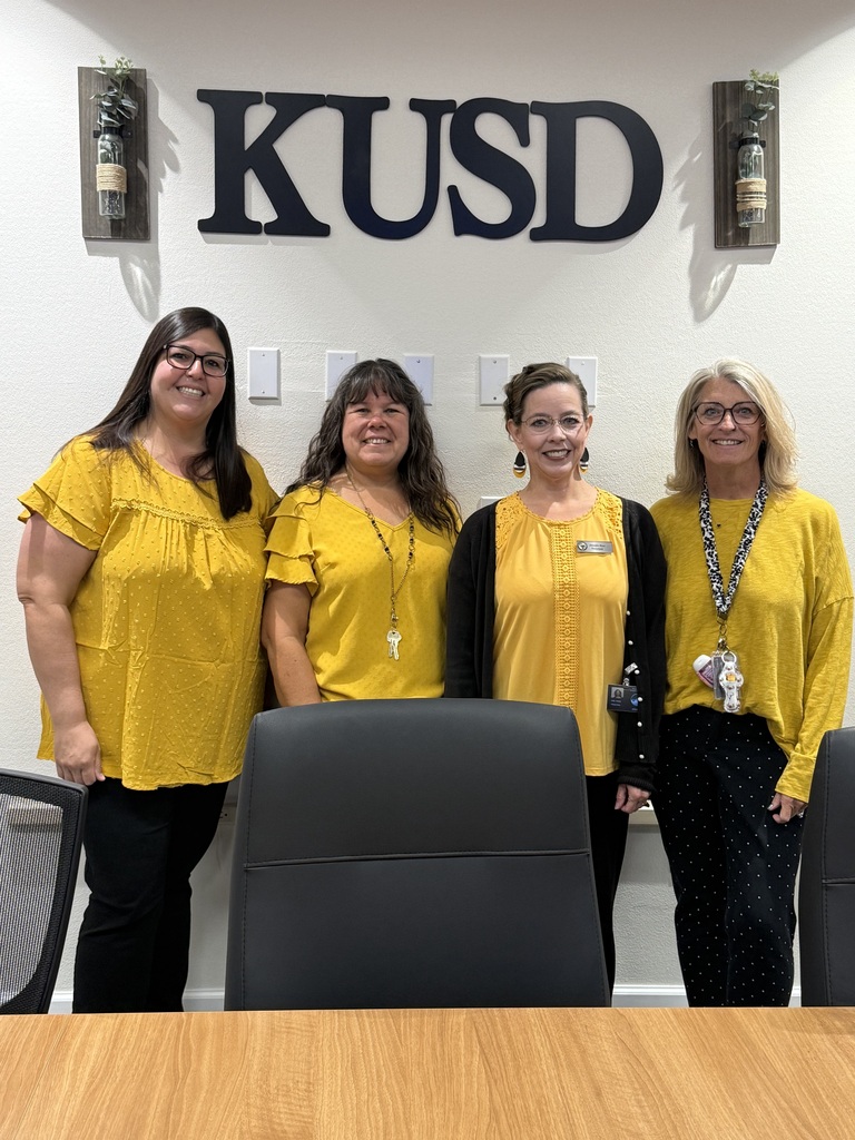 Staff wearing gold