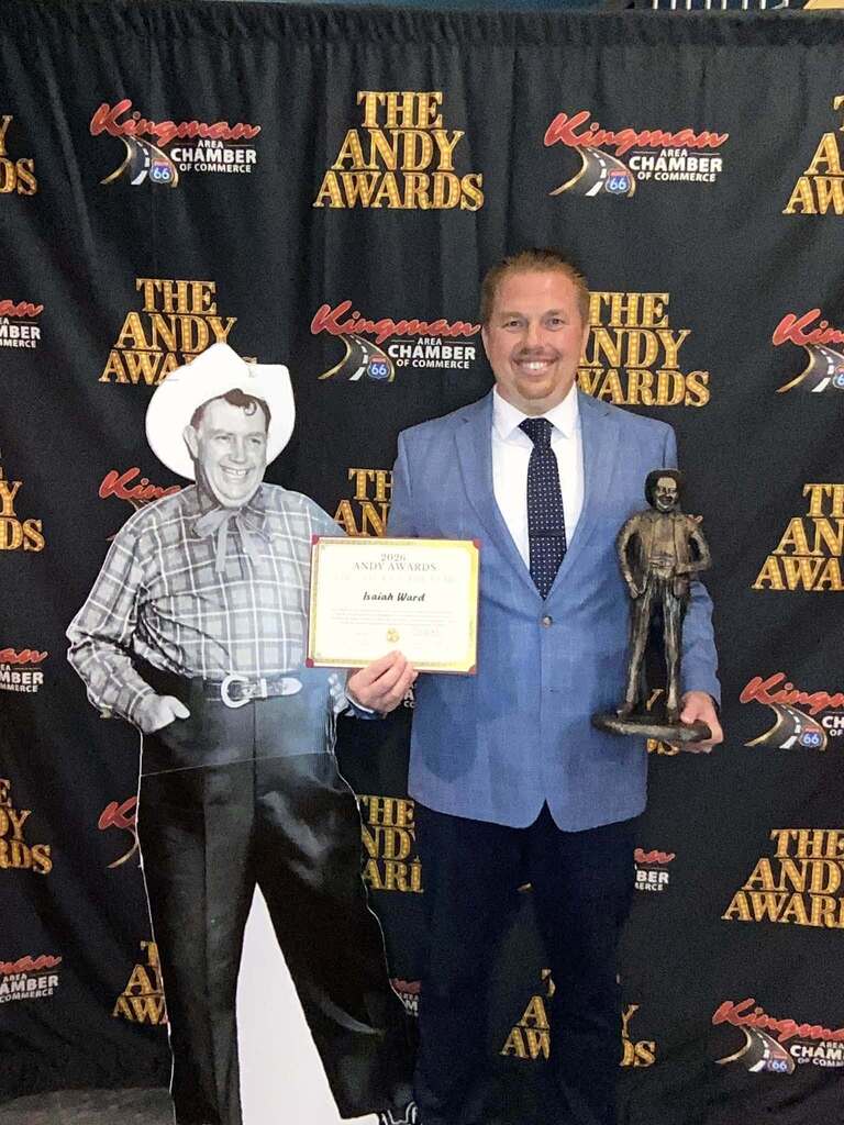 Mr. Ward posing with his Andy Devine Award