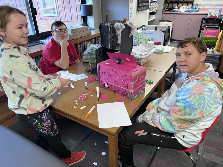 This crew designed a haunted barn, complete with red strips of paper for real siding!