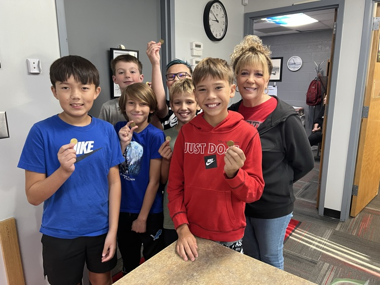 Getting book tokens from Mrs. Carol.