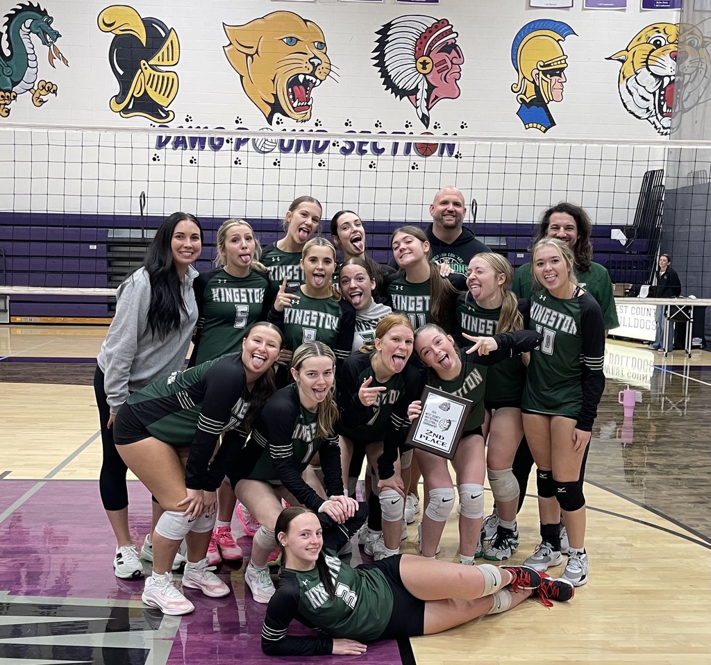 Varsity Volleyball takes silly picture with trophy from 2nd place finish at West County Tournament