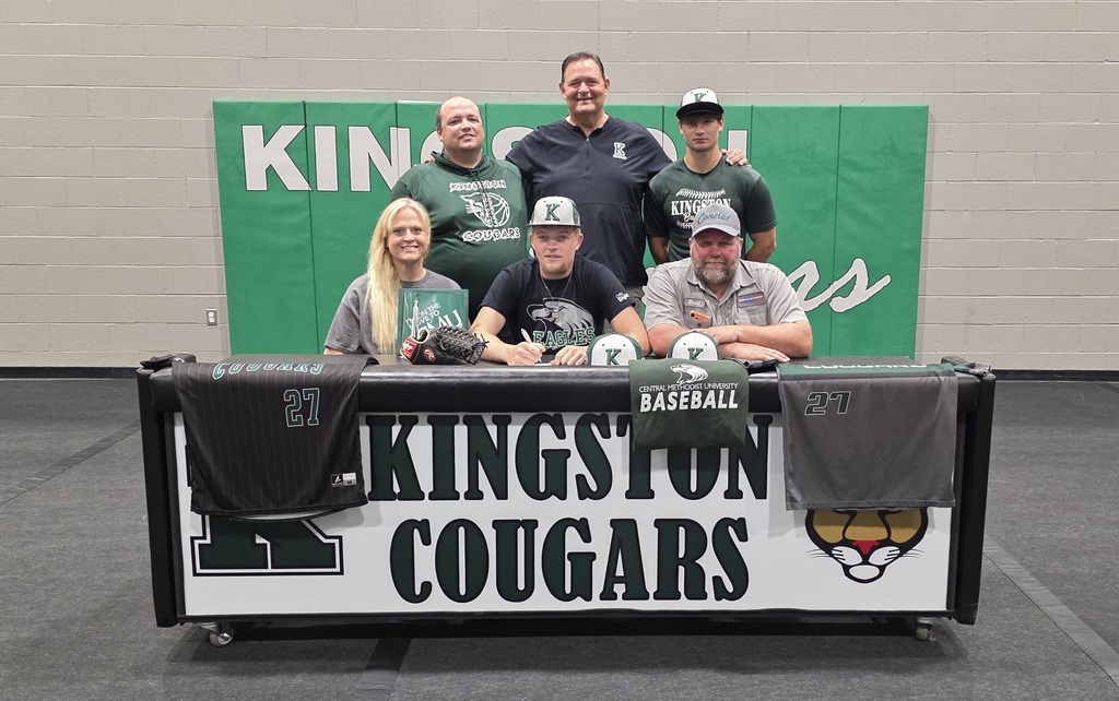Joey Hahn with parents an coaches