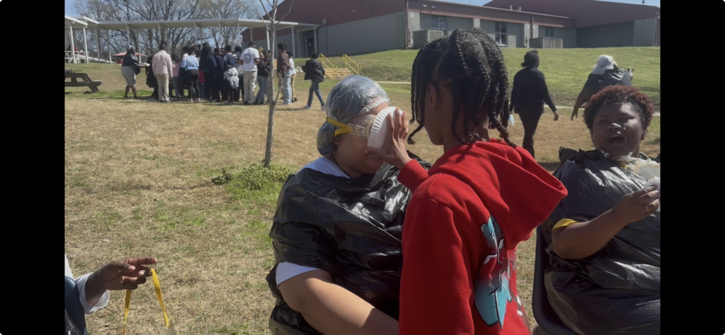 😮 The face you make when you realize you’re next! Ms. Calhoun is watching in absolute awe (and maybe a little relief?) as Ms. Hubbard takes one for the team!