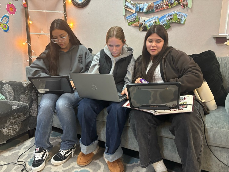 students working on yearbook