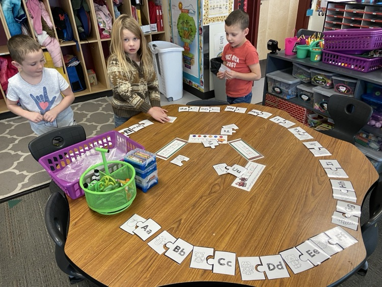 students working on picture puzzles