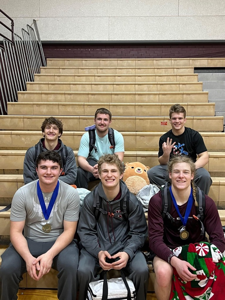 wrestlers sitting in bleachers