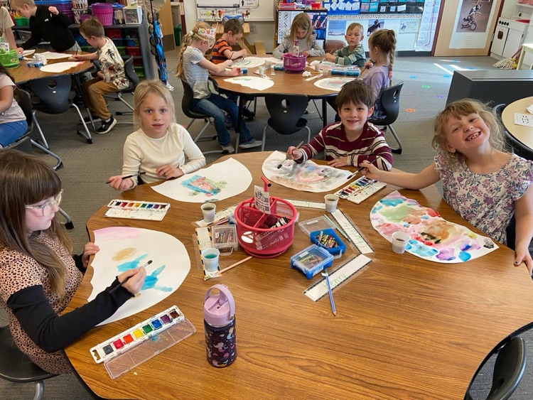 students painting umbrellas