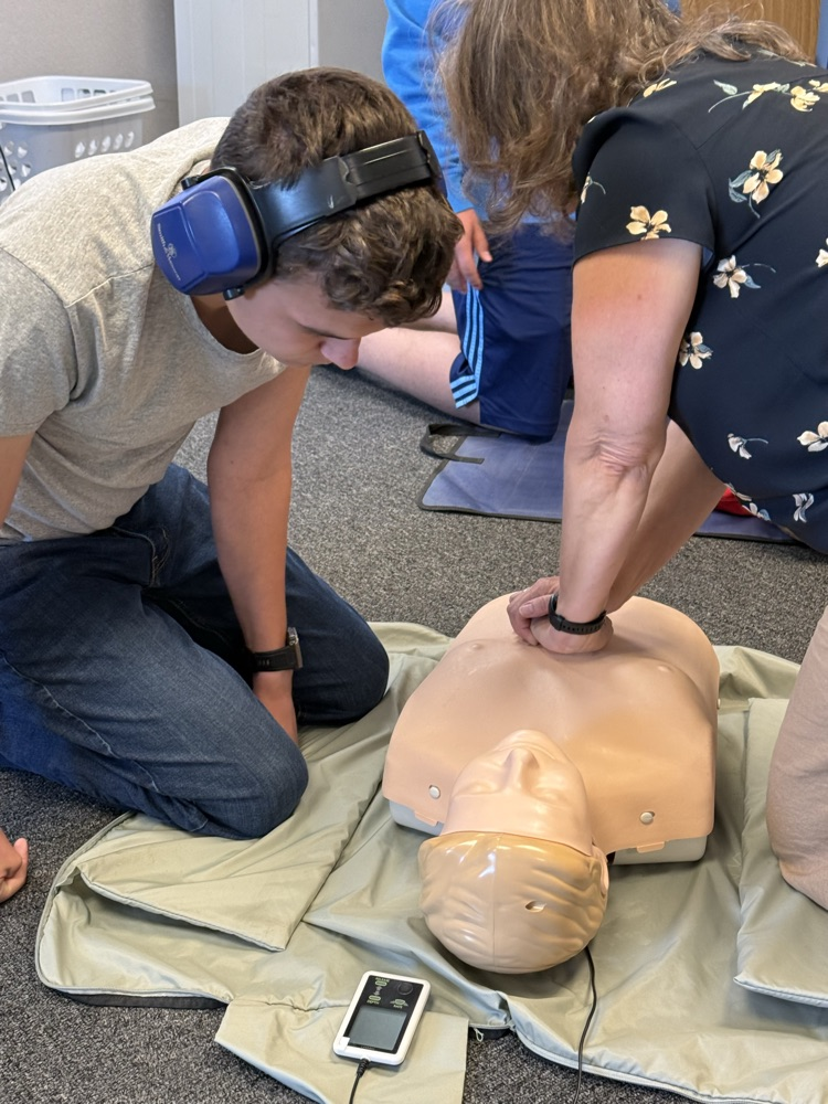 student learning CPR
