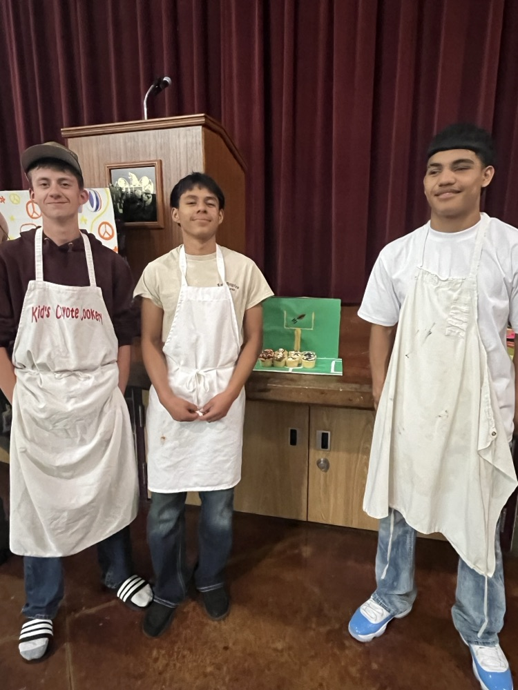 students showcasing cupcakes