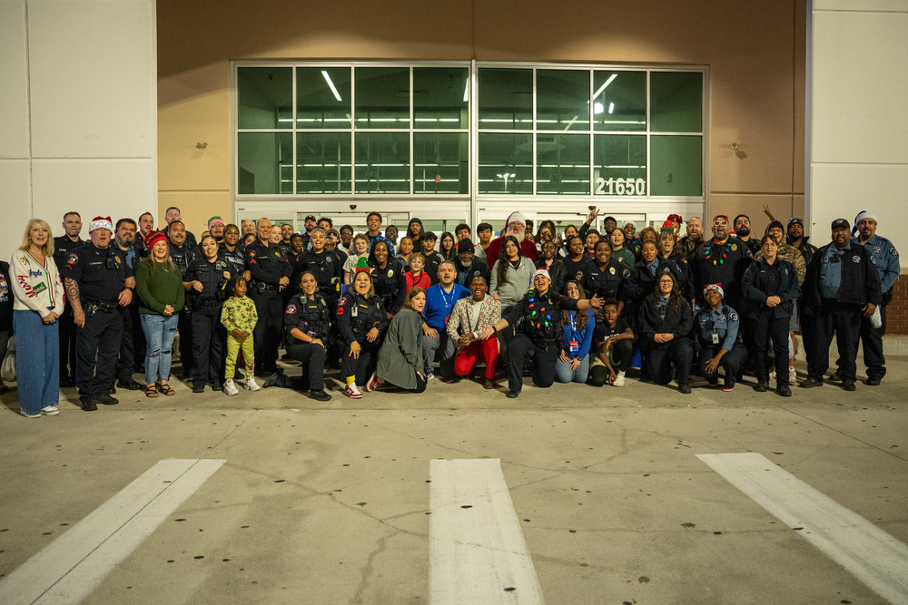students and police pose for photo