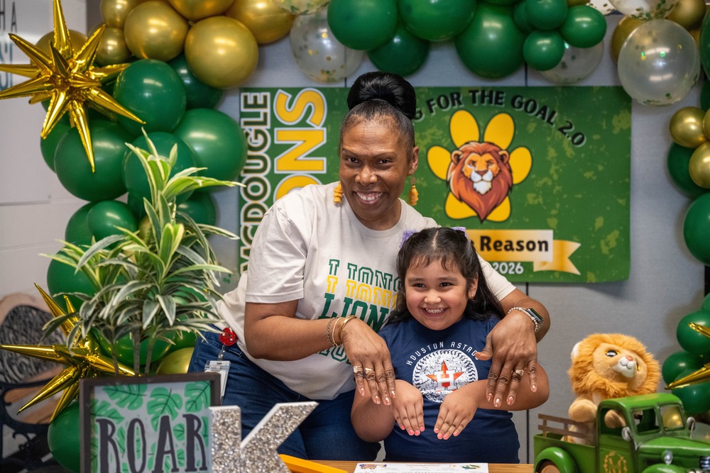 Principal Hazel Berry poses with kindergartener 25-26 school year
