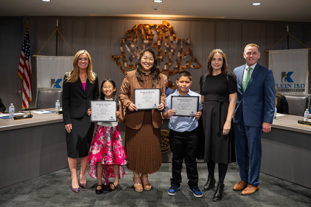 student and teacher at board meeting