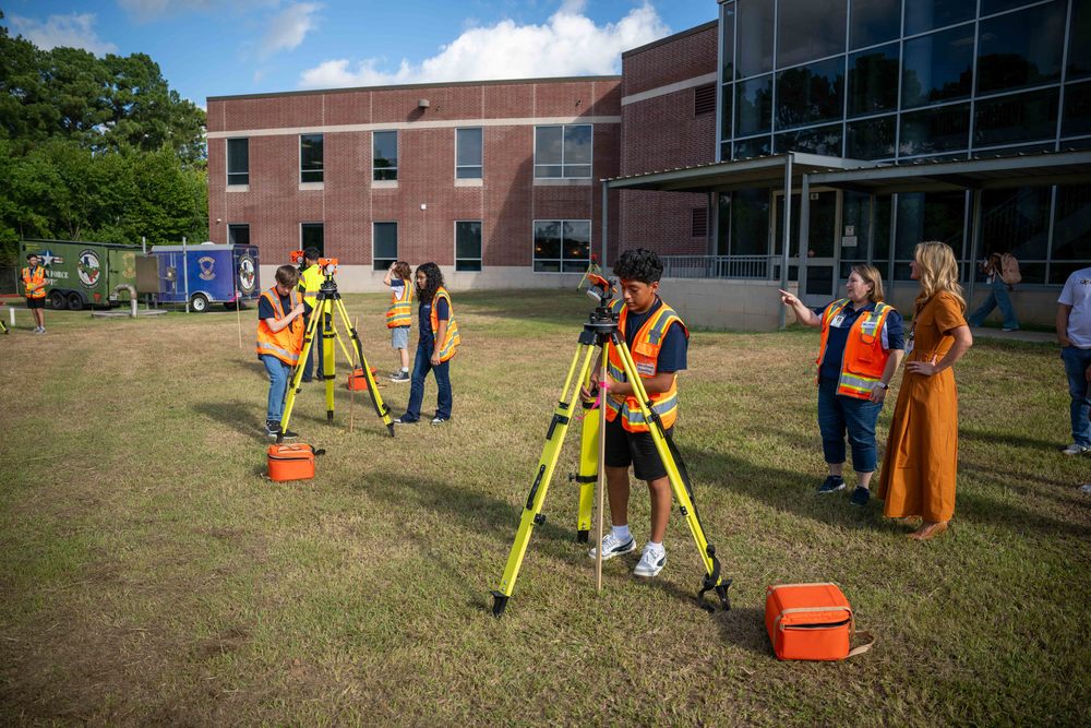 Superintendent Dr. McGown observing Geospatial Engineering and Land Surveying Students at Klein Collins