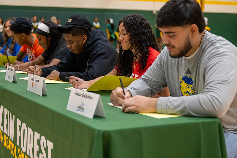 Students signing their letters of intent