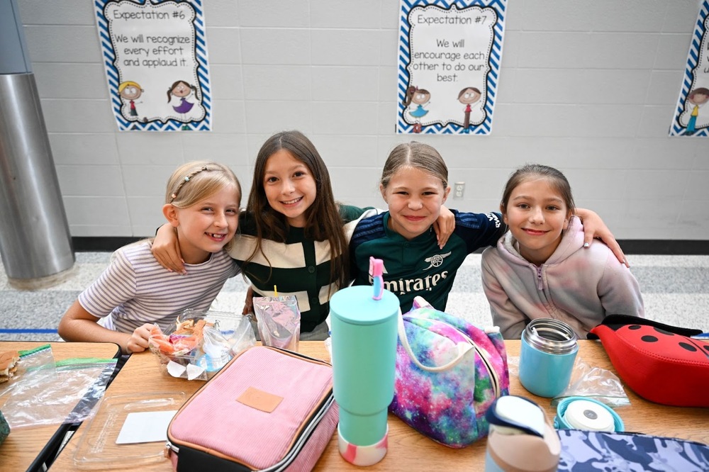 girls smile at lunch