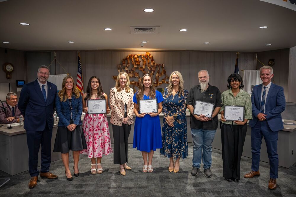 Tommy Tunes Award Winners smile for photo at board meeting
