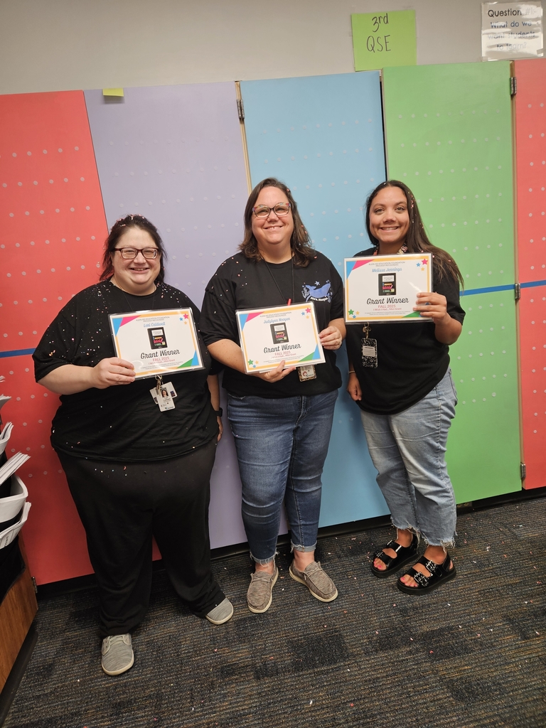 3 teachers holding certificates and smiling