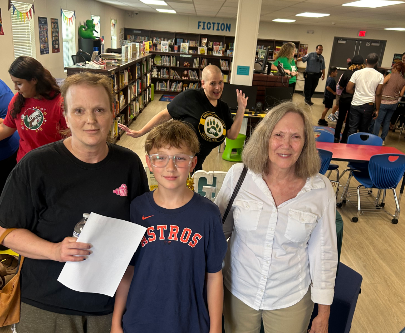 PTO President with student family in blue shirt 