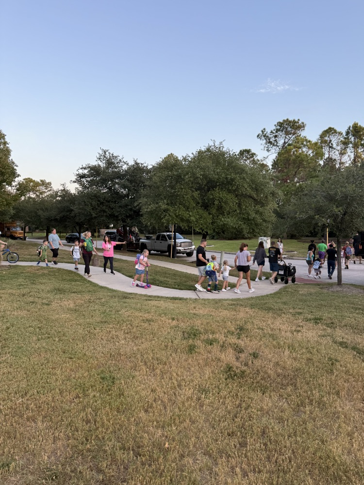 students and families walking to school