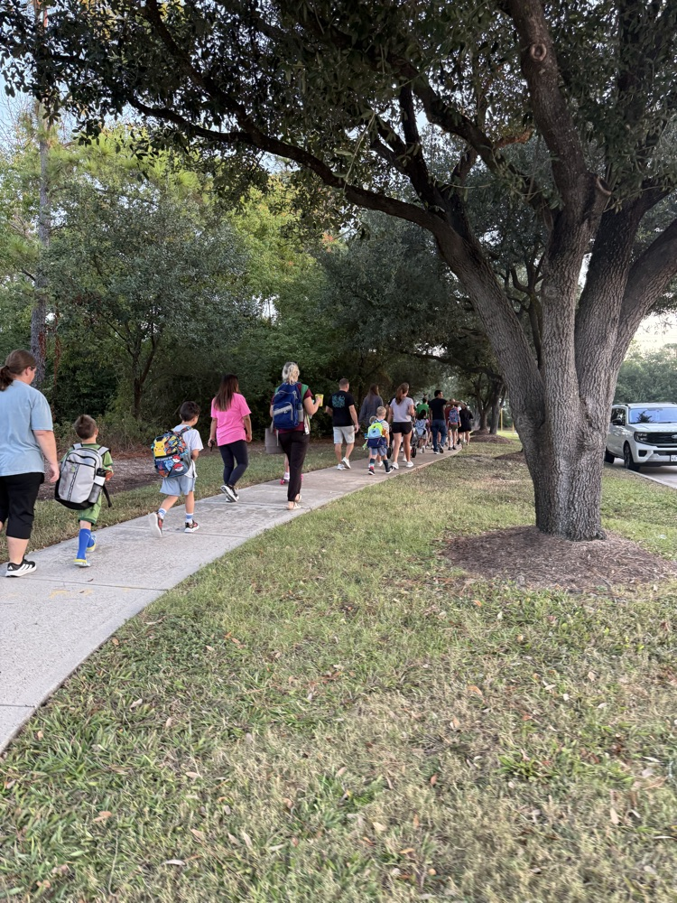 students and families walking to school