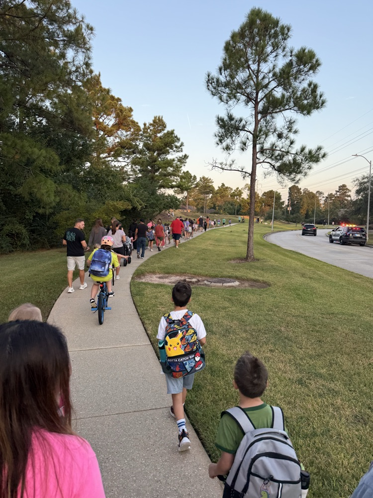 students and families walking to school