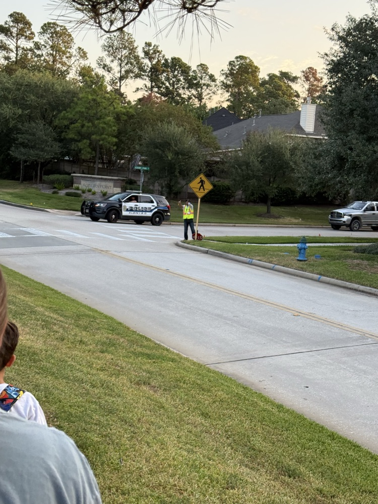 students and families walking to school
