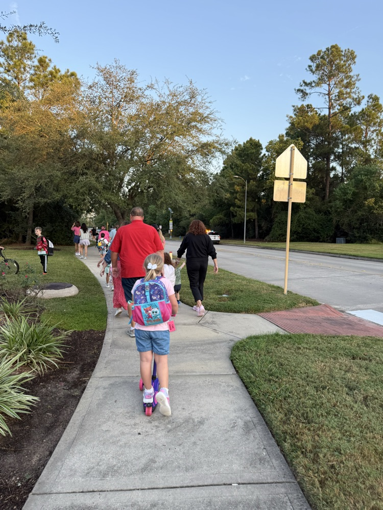 students and families walking to school