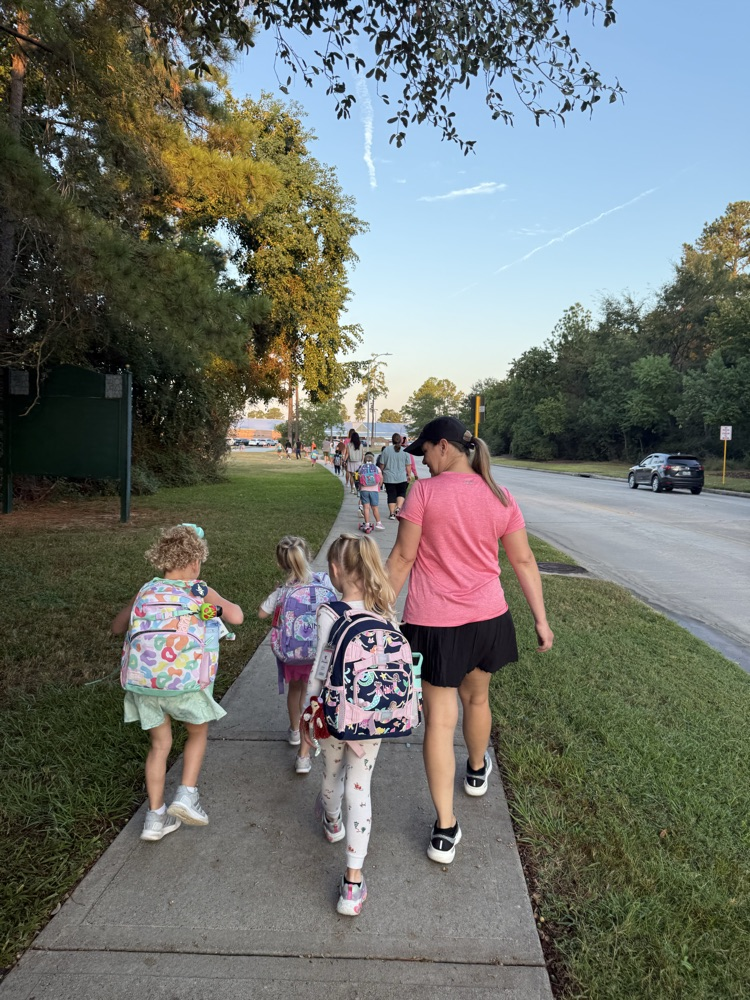 students and families walking to school