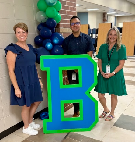 Ms. Mielits, Mr. Menendez, and Ms. Madrid at a back to school event.