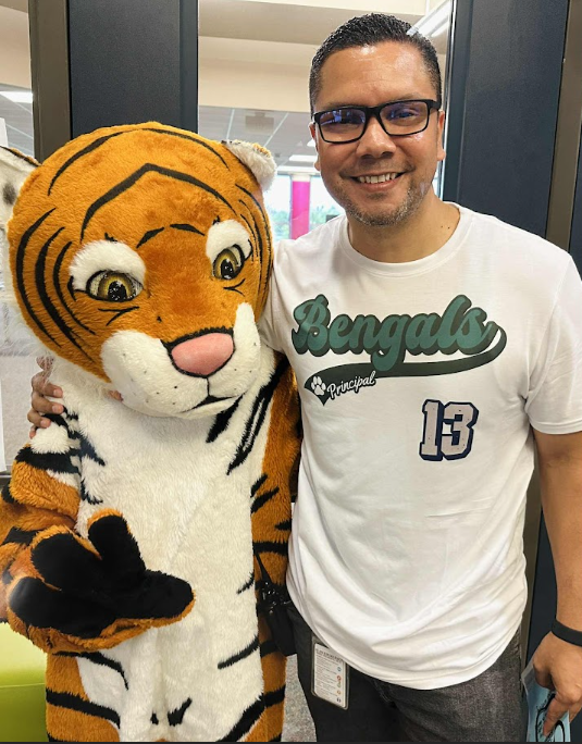 Mr. Menendez with our mascot, Stripes
