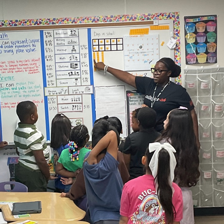student teacher reviewing place value with students before circles