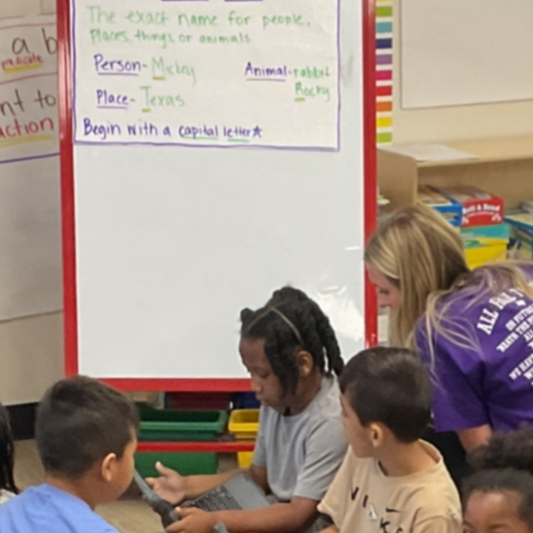 resident in purple shirt providing support to students during turn and talks