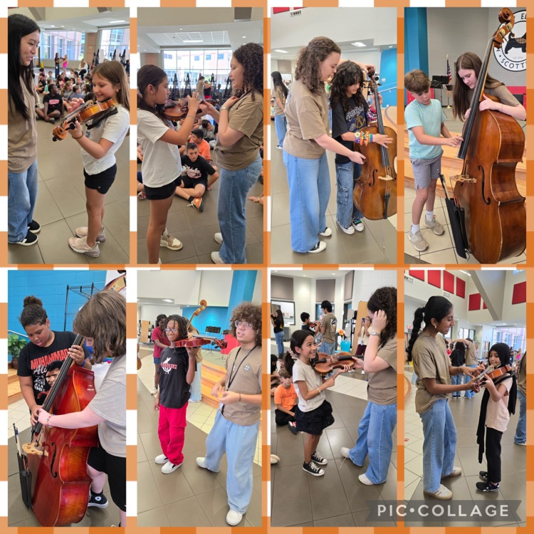 Mahaffey 5th grade students trying out strings instruments