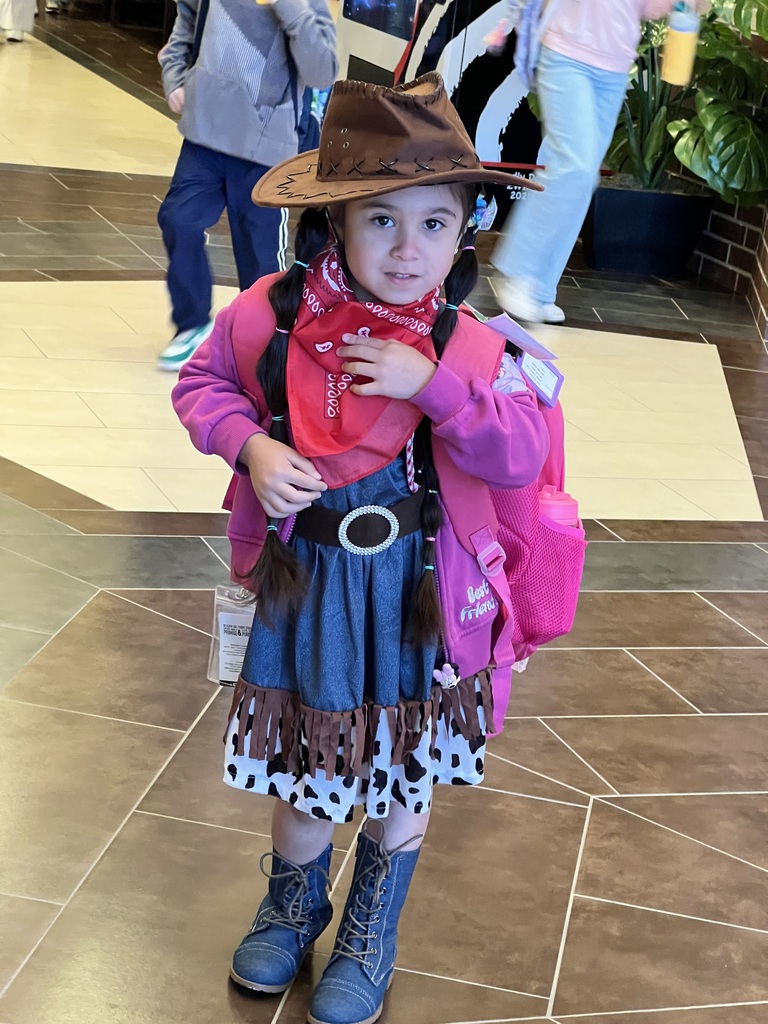 Student poses for cowboy boots and hat day