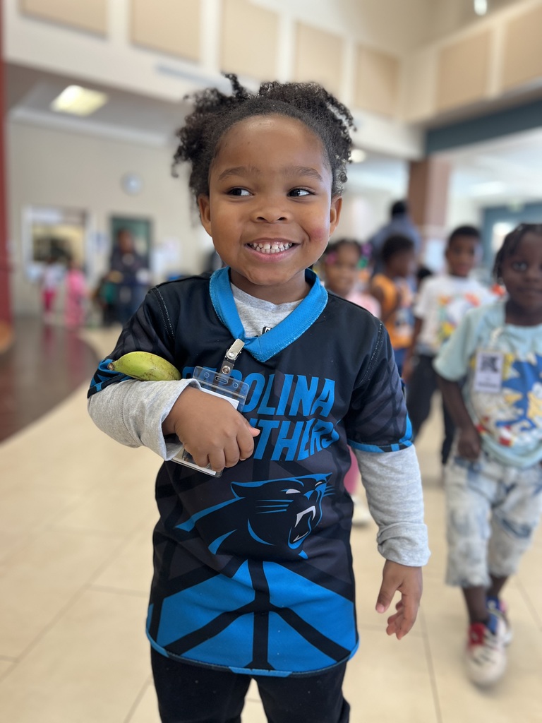 Student poses for team shirt day