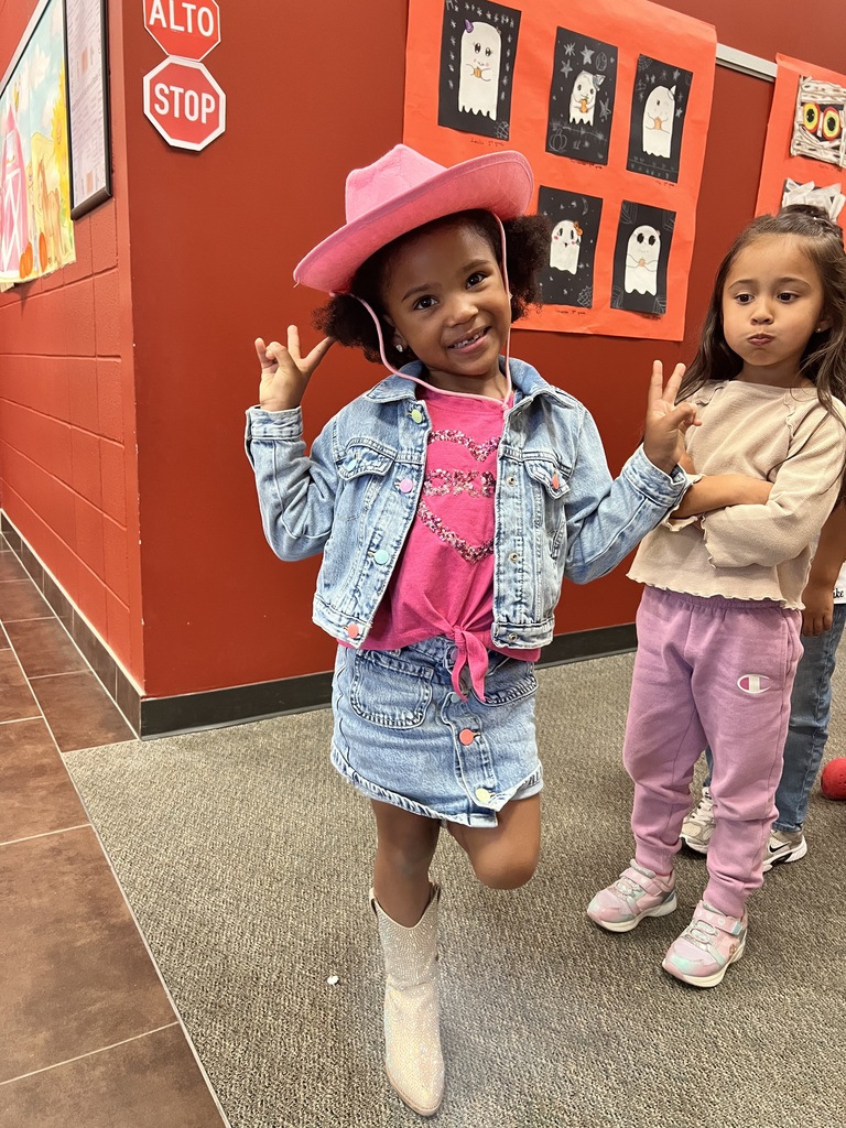 Student poses for cowboy boots and hat day